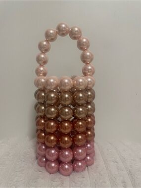 Vanina handcrafted glossy pearl pink/taupe top handle cylinder bag
